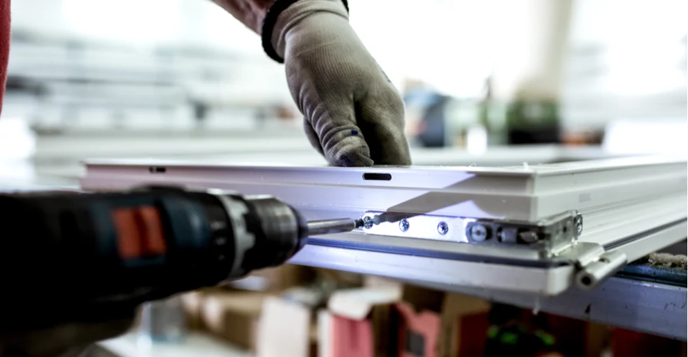 Coetz window hardware being fitted during manufacturing