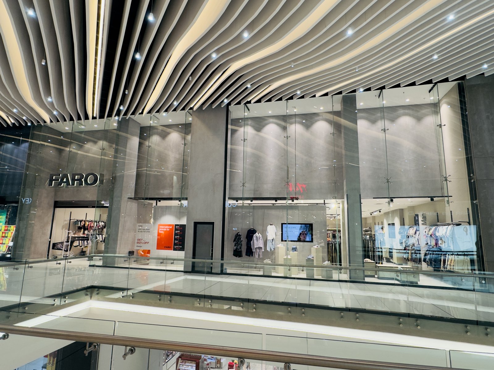 Automatic doors Mpumalanga, North West and Northern Cape — automatic glass doors at a retail entrance | Coetz Glazing / MC Automations