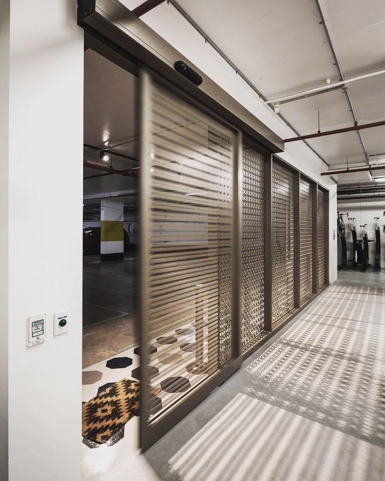 Automatic sliding door with architectural feature panels