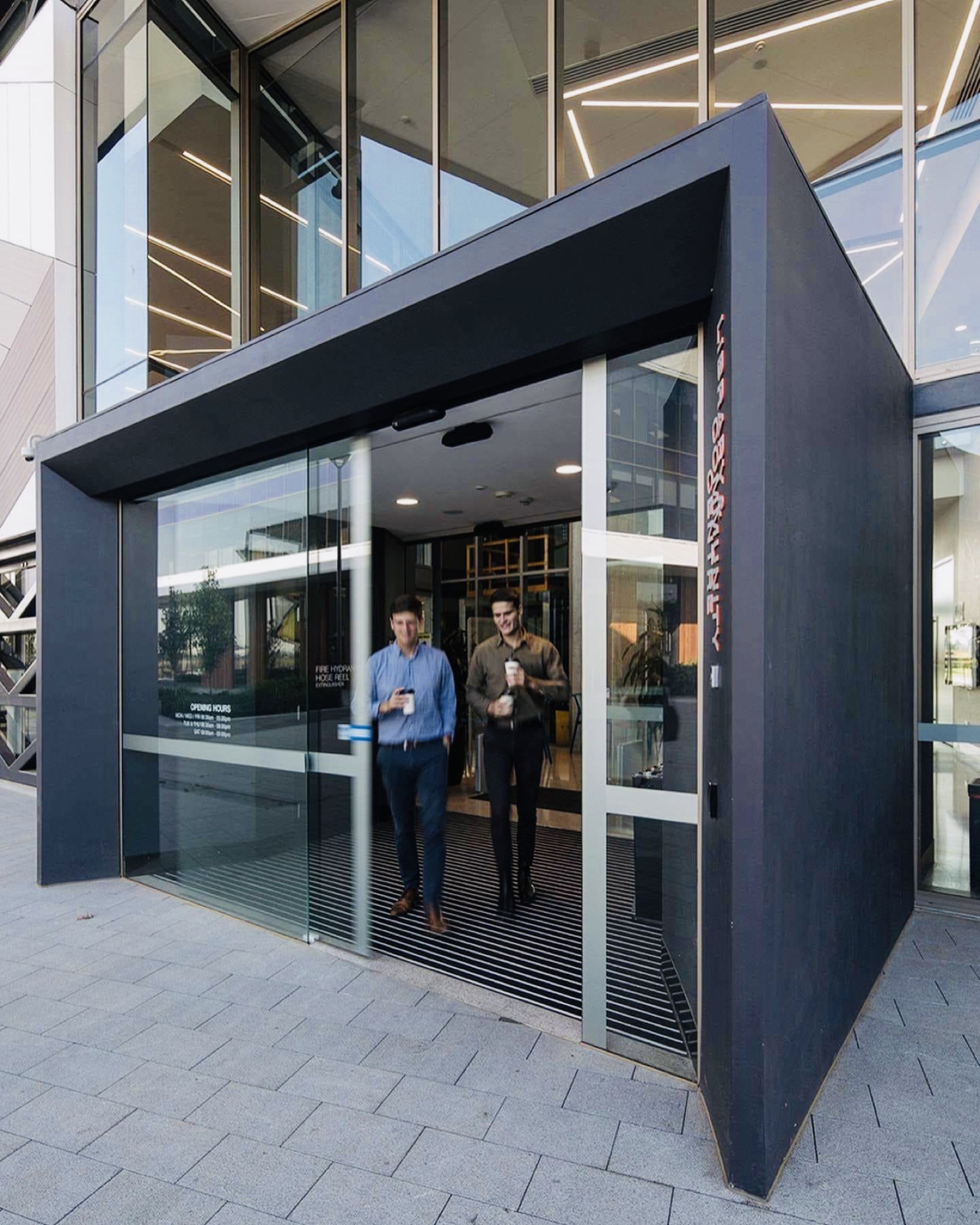 MC-125 automatic sliding door system installed at a commercial entrance — Coetz Glazing
